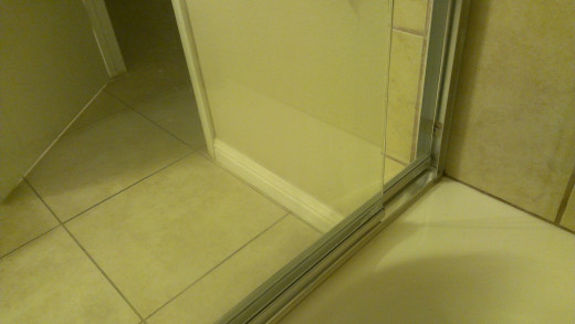 Shower door after using lemon directly on the glass, lightly rubbing in large circular patterns with a non-scratch pad. Wow, what a difference!