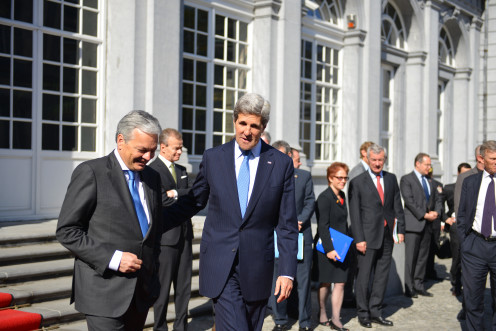 U.S. Secretary of State John Kerry walks with Belgian Minister Reynders at Egmont Palace in Brussels, Belgium, on April 24, 2013