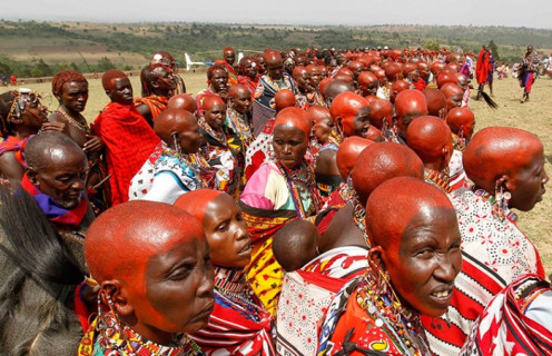 Kenya's Maasai women in a traditional ceremony with red ochre symbolizing beauty and maturity