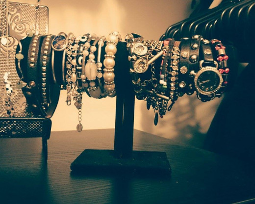 A bracelet holder can be found at many organizing or home stores for next to nothing. You can also make your own.