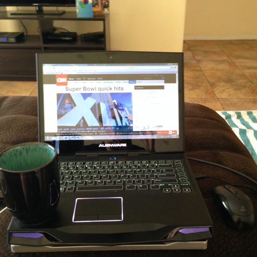 The updated version, computer CNN.com and cup of coffee