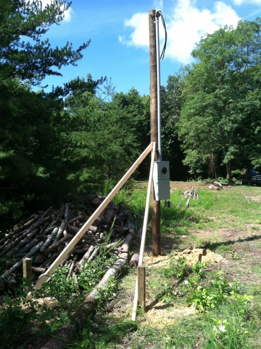 Temporary power pole installed and braced as required.