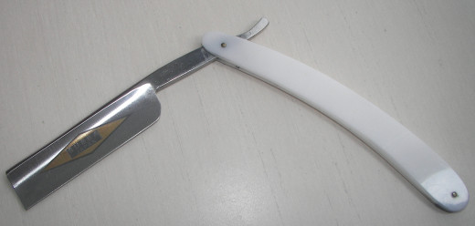A straight razor.  Learning to use this tool correctly will give you the best shave possible.
