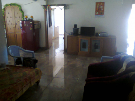 This is your writer residence on a 4th floor. Hall leading to his bedroom entrance in center. The puja room is on left and kitchen and bath on right side. There are 2 more rooms - one opposite puja room and one opposite kitchen which are not shown