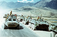 Soviet troops (in right row) withdrawing from Afghanistan in 1988. Wikipedia.