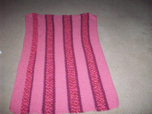 Afghan made from scrap yarn for my daughter's gymnastics team.
