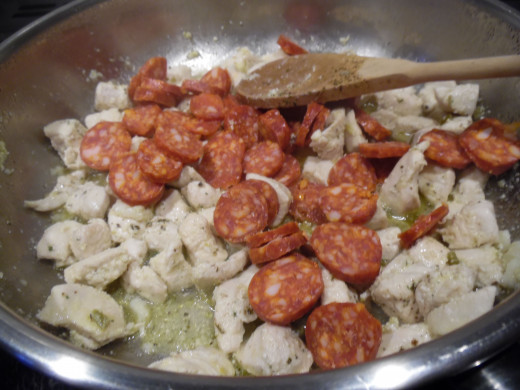 once chicken browned, add chorizo.