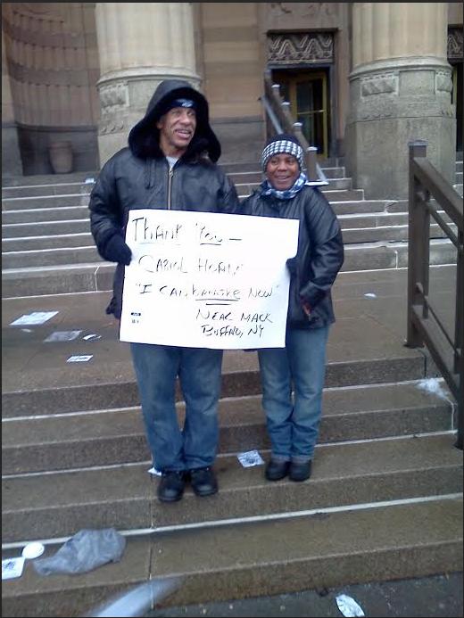 Neal Mack-whom Former Officer Cariol Horne (pictured on the right) saved from a chokehold by a fellow-officer-attend a Police Community Relations rally in downtown Buffalo on 12/13/14. Source: photo courtesy the buffalo bullet