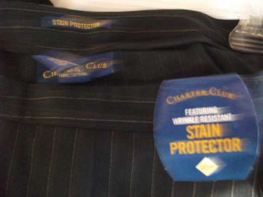 Want to save money and time? Look for clothing that repels stains, like these pants from Charter Club.