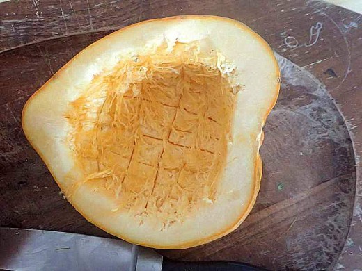 Cut cross hatch pattern into the flesh of the squash