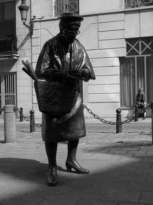 Madame Chapeau (Brussels,Begium)   Designed to create a dynamics between two streets, this sculpture beams with its presence in the space that was allocated to the artist.The lady is fearlessly counting her money in an area of Brussels that is famous