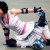 A roller athlete doing stretching while a derby A roller athlete doing stretching while a derby