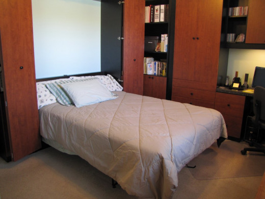 Murphy beds fold up into a cabinet. This is one way to accommodate guests. 