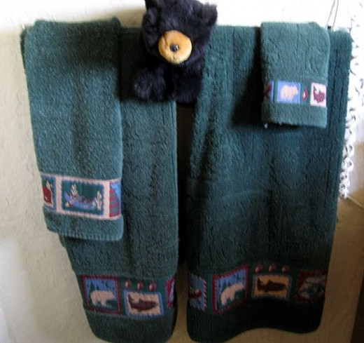 Make sure you have plenty of towels and a place to hang them. Aren't these bear towels perfect for a cottage in the woods. You can find ones with seashells too for the beach cottage.