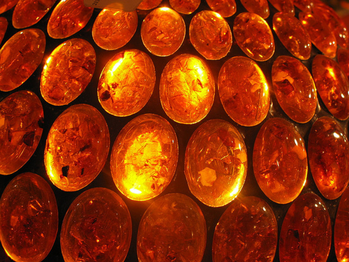 A polished amber stone is a good crystal for healing stomach aches and pains. 