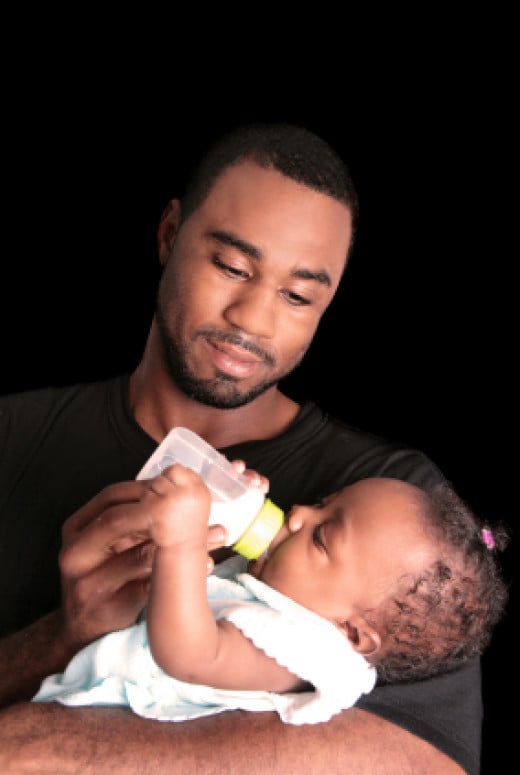 Father feeding daughter