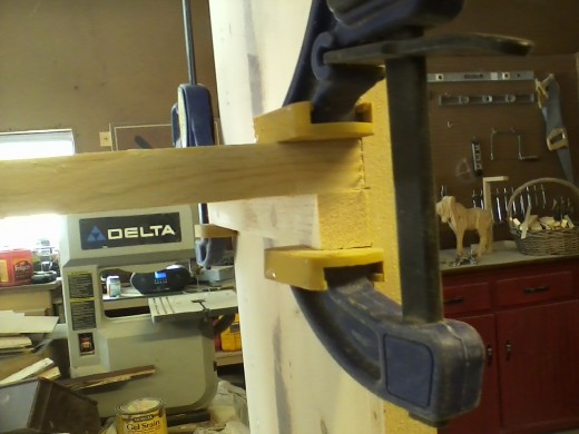 Gluing the shelf to the ledger board.