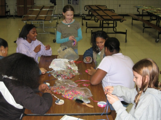 Girl scouts meeting in a modern venue to learn crafts. 