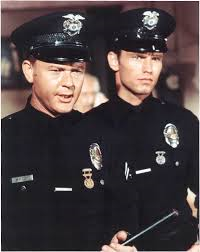Milner, left, as "officer Pete Malloy, and Kent McCord as "officer Jim Reid"