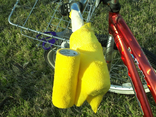 You'll want two layers of vet wrap over the diaper. Wrap onto the handlebar and press the vet wrap into place.