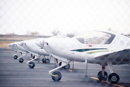 Flight school training aircraft parked at ramp. 