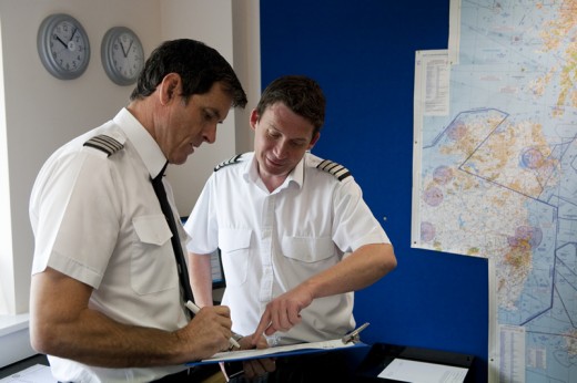 Flight instructor checking student pilot's flight planning, mainly flight calculation and weather report. If you cannot understand anything don't hesitate to ask your instructor.