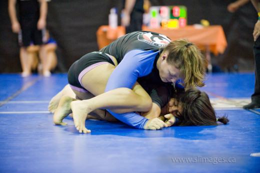 Individuals of varied ages, backgrounds and genders practice Brazilian Jiu Jitsu.