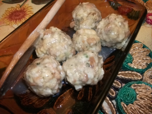 A close up of the stuffing balls in a serving dish.