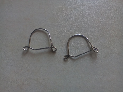 This kind of earring hooks with both eye at the back and front of the ear is mostly what I use. It's a great way to have more dangling beads and securely hanging when dancing.