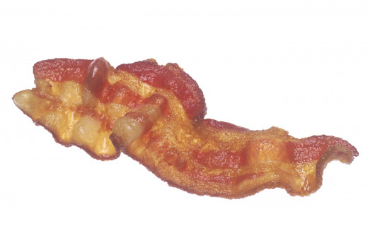 A strip of pan fried bacon.  This particular strip is on the chewy, as opposed to the crispy side.