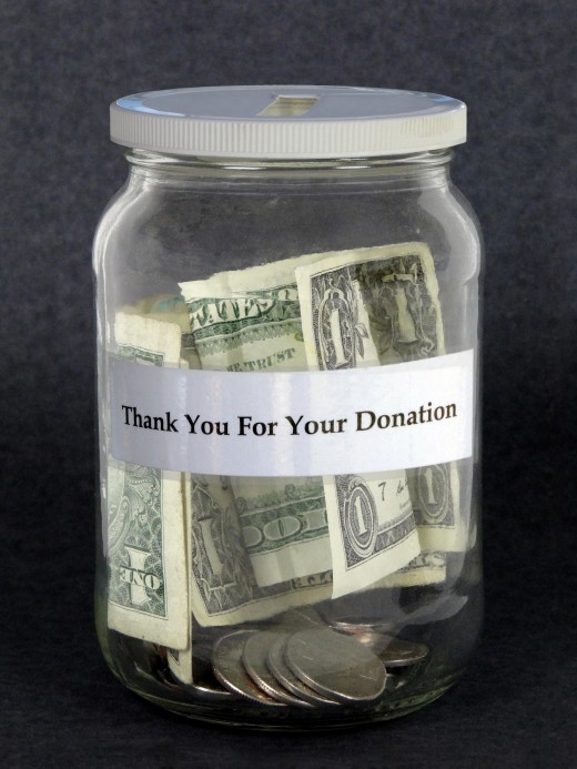 donation jar with green dollar bin and the words thank you for your donation typed on the jar