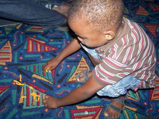 My nephew was picking up cheese sticks he spilled all over the floor on the boat