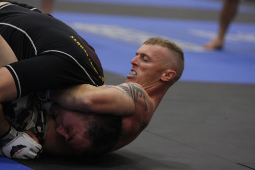 The tighter you keep your shoulder to your opponent's spine, the lesser their chances of slipping out of the guillotine choke.