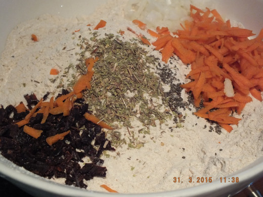 Next, I add the sundried tomatoes, carrots, onions, and more oregano (I really like that herb).