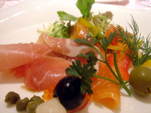 Salmon slices in a salad.  Salmon is one of the leading sources of quality fat needed for proper brain function.