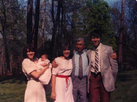 Easter, 1982. My grandfather with me, my sister, aunt and cousin, doing something out-of-character for his generation.
