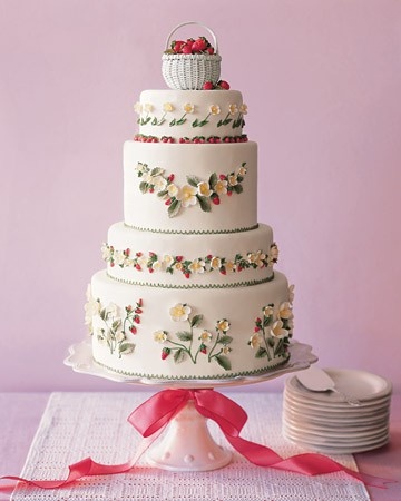 Decorate your wedding cake with a sweet floral and strawberry design, and topped it with a basket of fresh strawberries