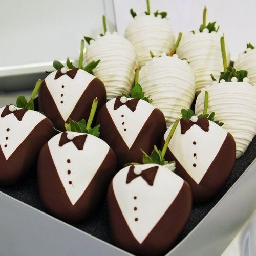 No strawberry wedding theme can be without these chocolate-coated strawberries in white lace and tuxedo