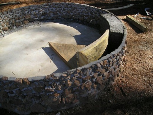 “Pie wedges” of plywood, created by gluing several layers of cut pieces together, were used as a mold to backfill the area behind the rock wall with concrete and create the fountain’s interior wall.