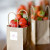 Strawberries in small paper bags as table numbers