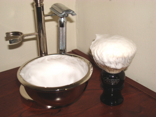 A traditional wet shaving kit.  A shaving brush is a very effective exfoliator to adequately prepared and hydrated skin.
