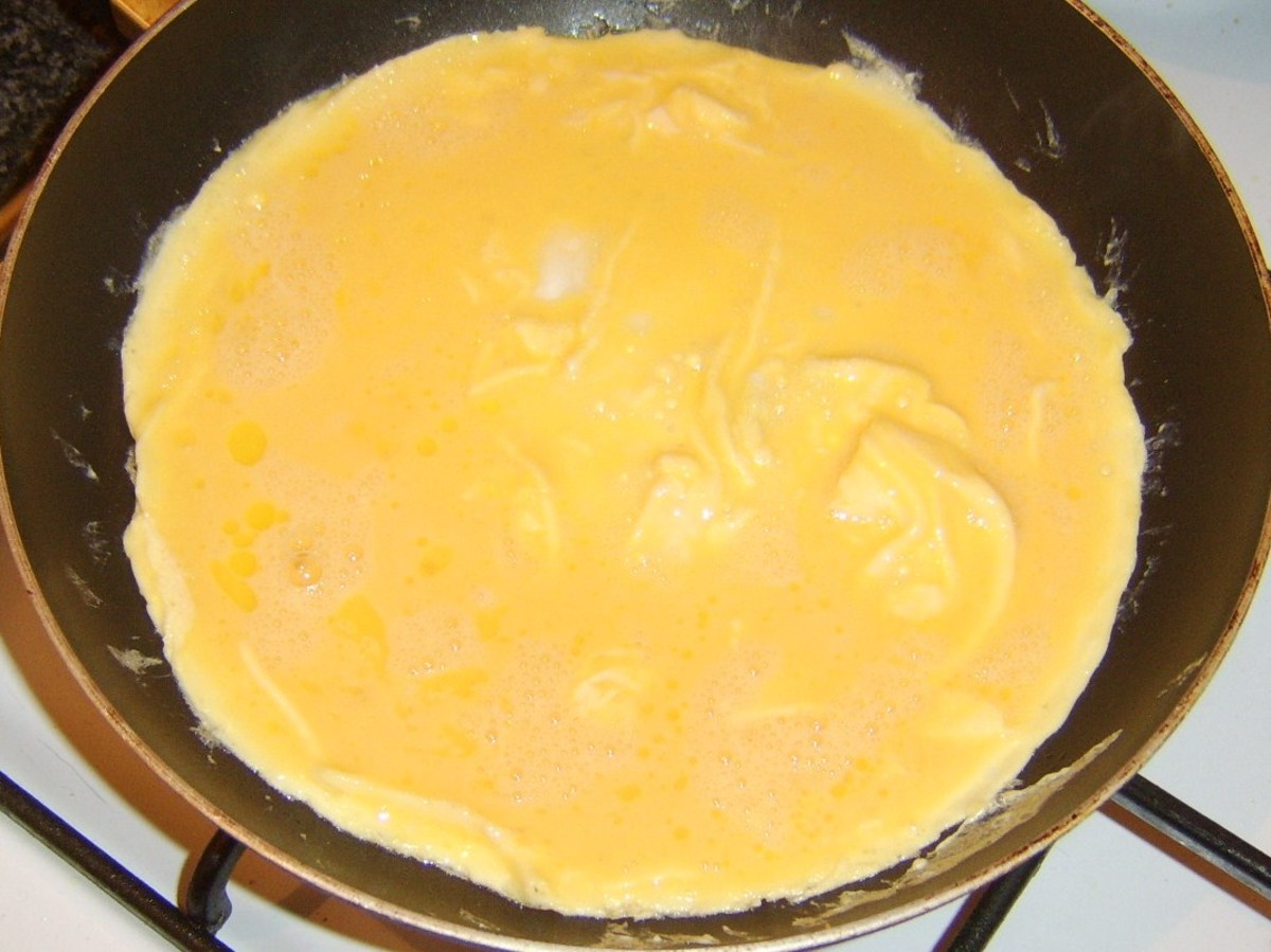 Making duck egg omelette