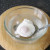 Poached egg is dipped briefly in iced water to stop it cooking