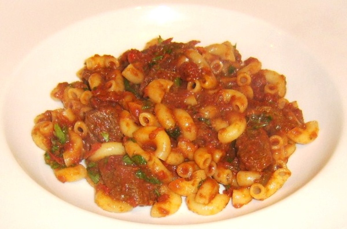 Spicy beef and tomato stew with macaroni is plated