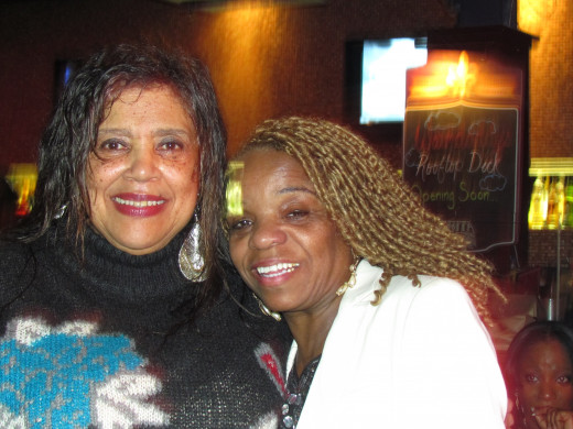 Paulette Blake, wife of Jerry Blake poses with an a family member of Point Blank.