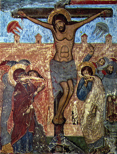 In this picture of the crucifixion on either side of the cross is what appears to be flying saucers. 