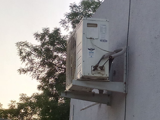 Unit containing condenser coil facilitates formation of bonds so that heat is released making it hot. Hence installed outside the room.