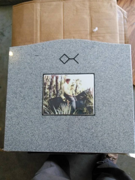 Single grey granite upright with 8x10 porcelain photo and black lettering