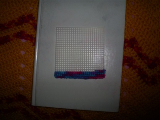 Here I have cross stitched a few rows and I am working my way up the piece.