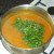 Chopped coriander leaf is added to celery and onion squash soup
